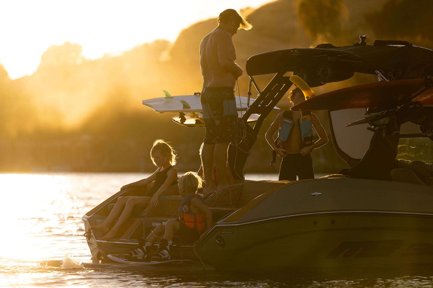 kids sitting in the rear facing transom seats on the new 21 alpha